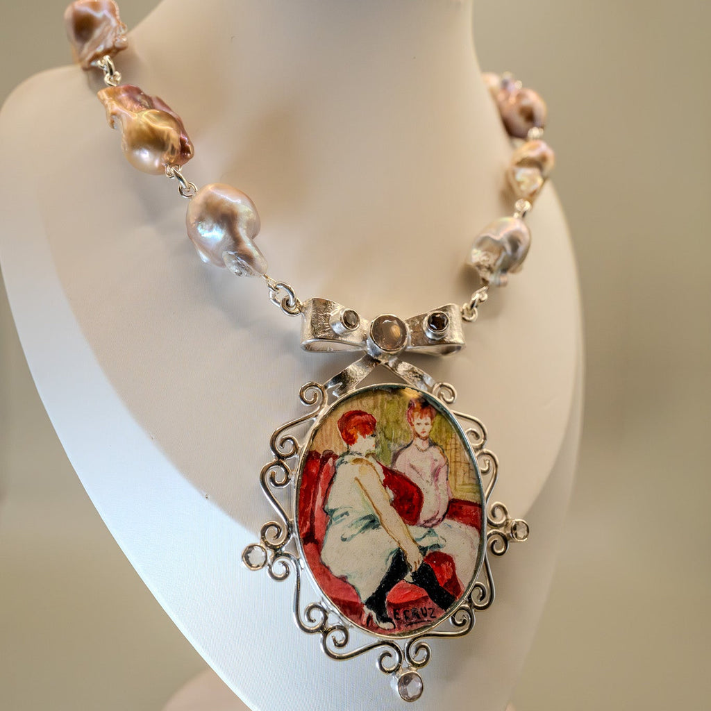 Necklace with a decorative pendant on a mannequin bust against a neutral background