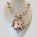 Necklace with a heart-shaped pendant on a mannequin bust against a plain background